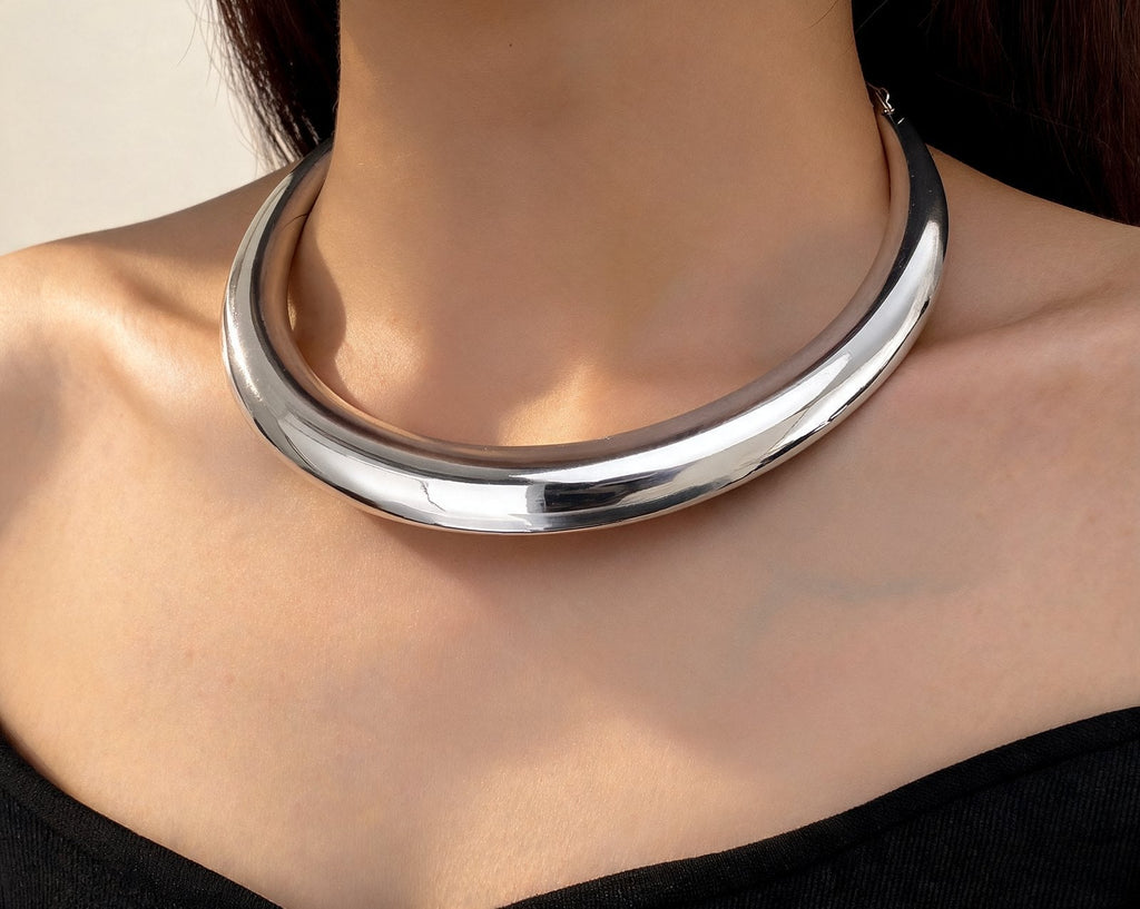 The Arc Collar in silver, worn