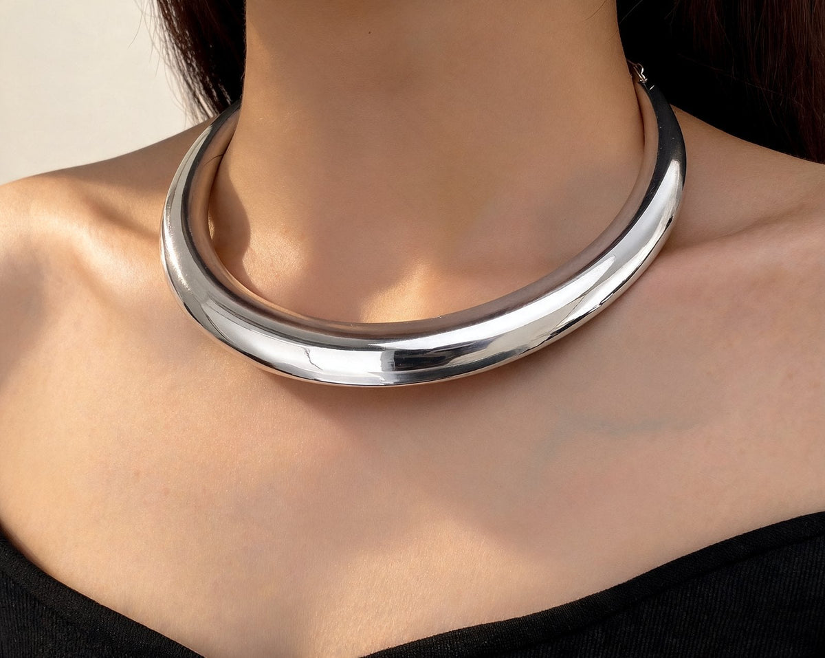 The Arc Collar in silver, worn