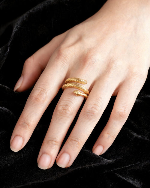 The Coil Ring in gold, worn
