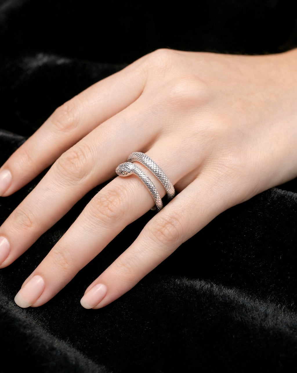 The Coil Ring in silver, worn